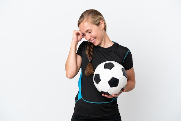 Young football player woman isolated on white background laughing