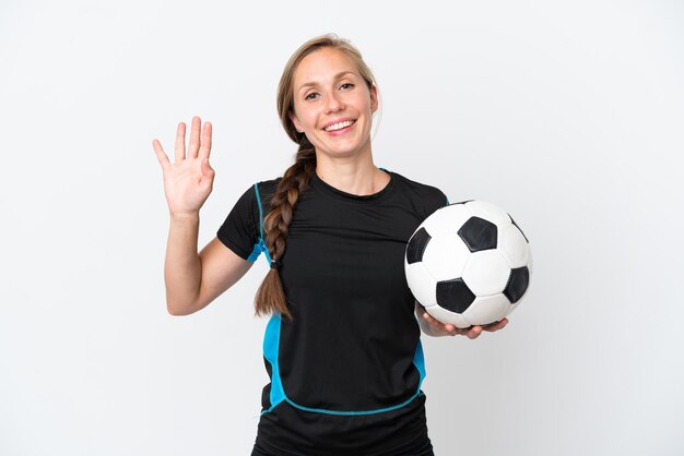 Young football player woman isolated on white background saluting with hand with happy expression