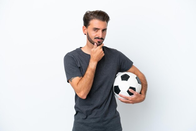 Young football player woman isolated on white background thinking