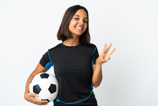 Young football player woman isolated on white happy and counting three with fingers