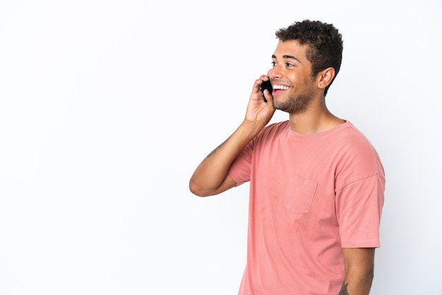 Young football player woman over isolated yellow background intending to realizes the solution while lifting a finger up