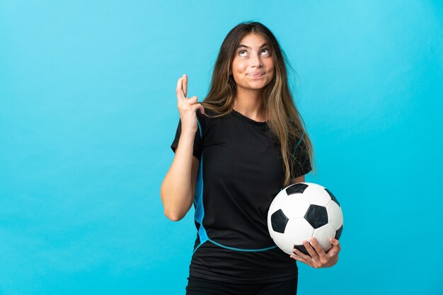 Young football player woman isolated