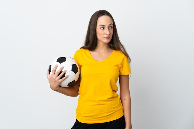 Young football player woman isolated