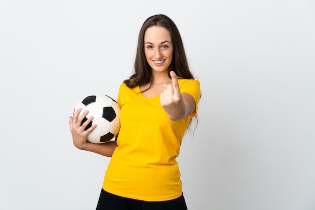 Young football player woman isolated
