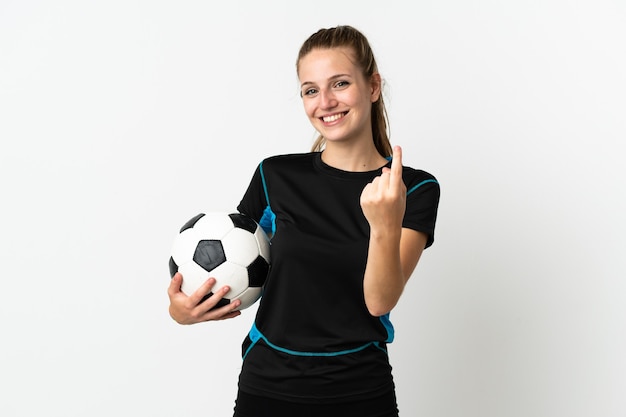 Young football player woman on white doing coming gesture