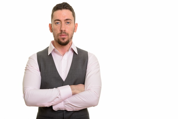 Young formal man wearing vest with arms crossed