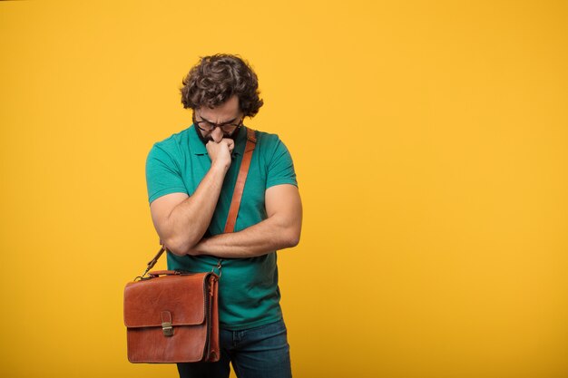 Young freelancer man expresing a concept against orange isolated