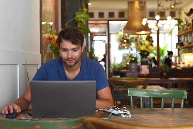 Young freelancer working in a cafe