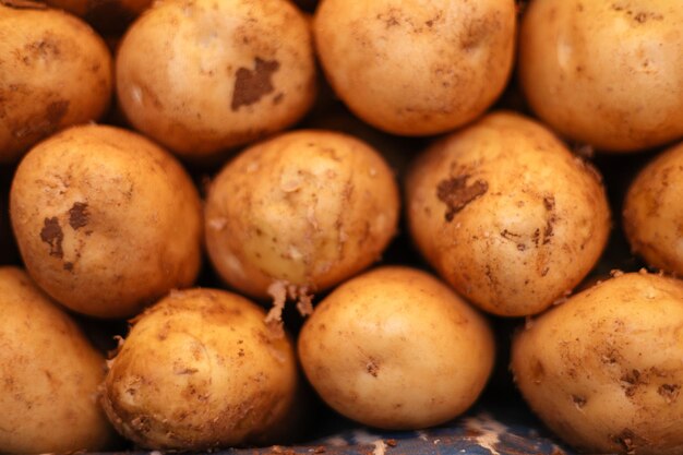 young fresh potatoes on a bazaar counter