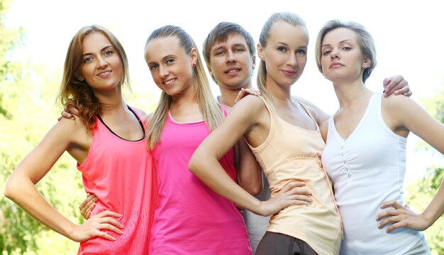 Young friends in a fitness wear outdoors