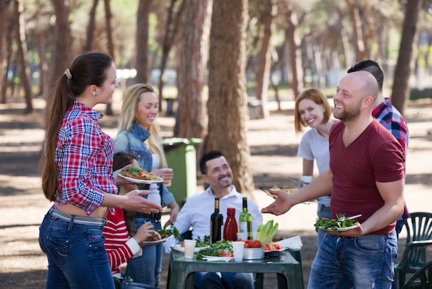 Young friends relaxing at grill