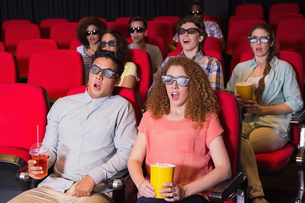 Young friends watching a 3d film