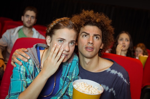 Young friends watching a film