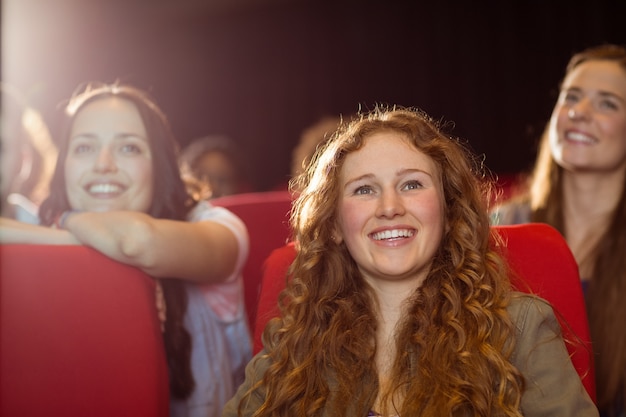 Young friends watching a film