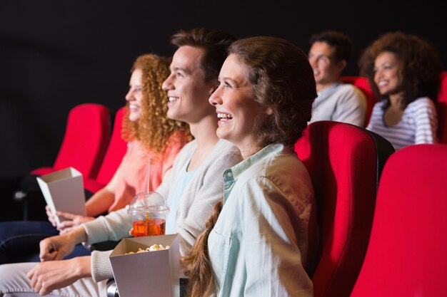 Young friends watching a film