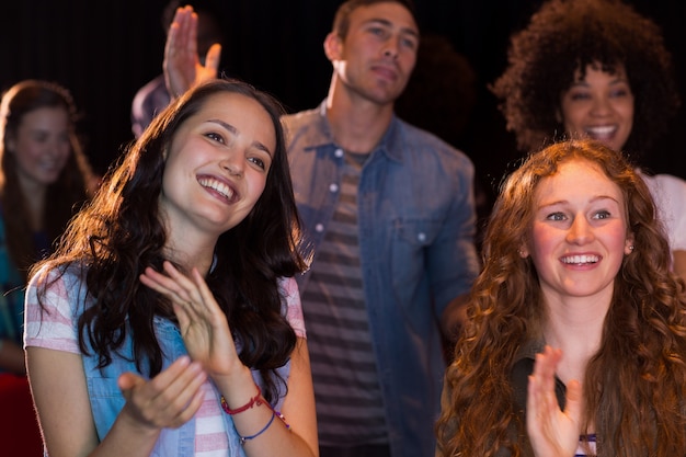 Young friends watching a film