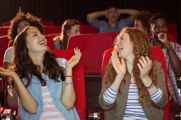 Young friends watching a film