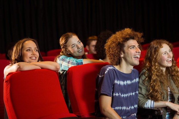 Young friends watching a film