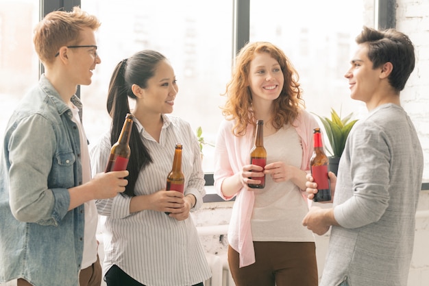 Young friends with beer