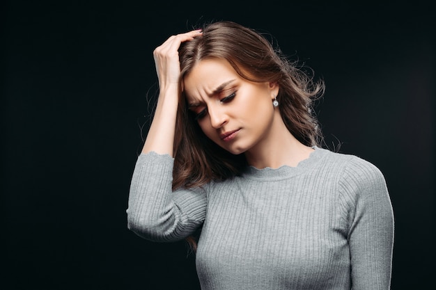 Young frustrated women looking down