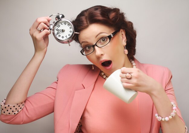 Young funny businesswoman having a coffee-break