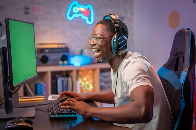Young gamer playing online video games while streaming on social media - Esports player