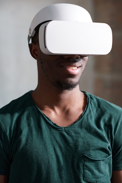 Young gamer watching virtual reality movie in 3D glasses