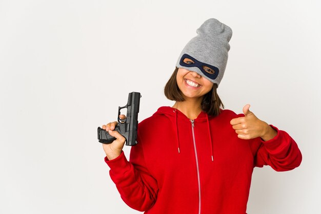 young gangster woman holding a gun