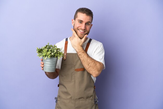 Young gardener over isolated background