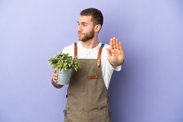 Young gardener over isolated background