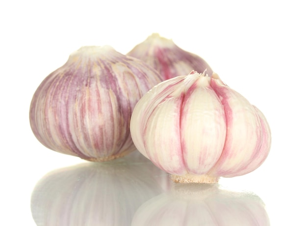 Young garlic peeled isolated on white