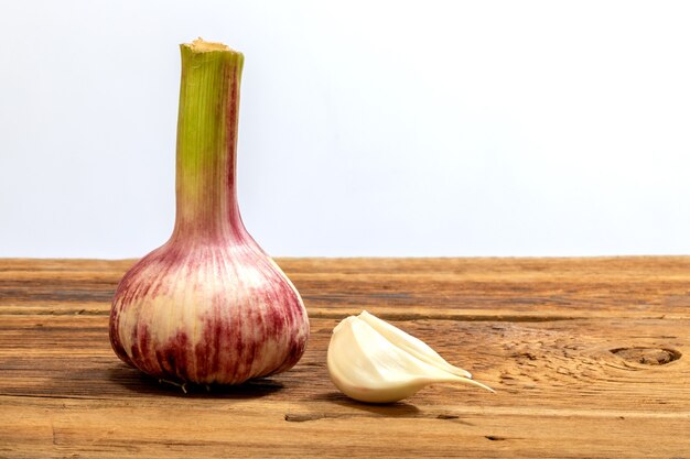 Young garlic on a wooden table