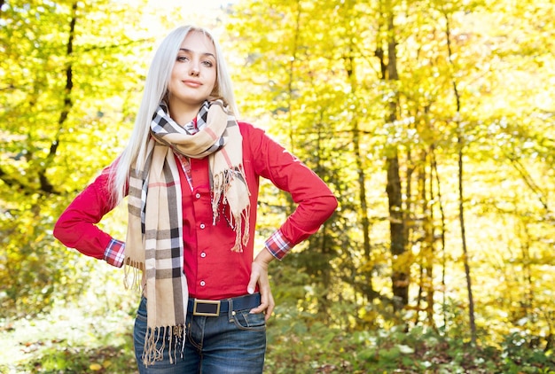 Young girl in the autumn forest