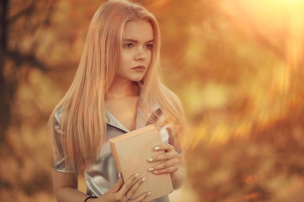 Young girl in autumn portrait, blond adult