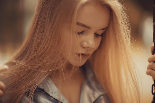 Young girl in autumn portrait, blond adult