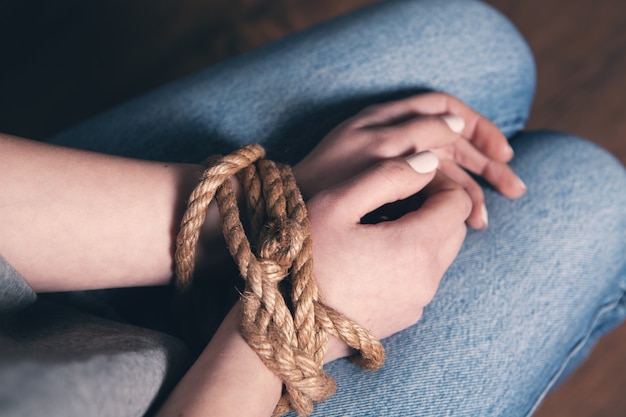 Photo young girl beaten and tied up