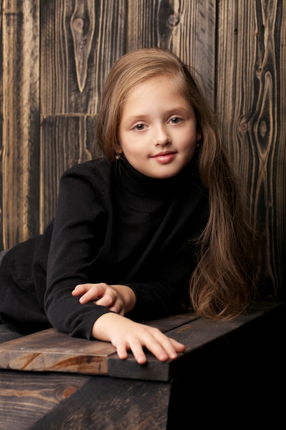 young girl in a black sweater
