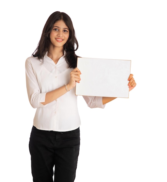 A young girl or businesswoman holding a signboard in her hands on a white background