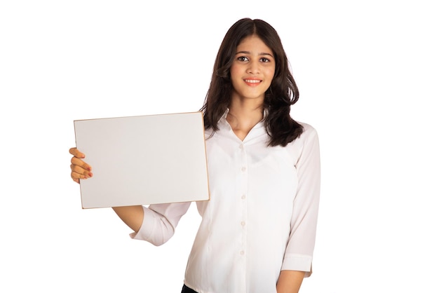 A young girl or businesswoman holding a signboard in her hands on a white background