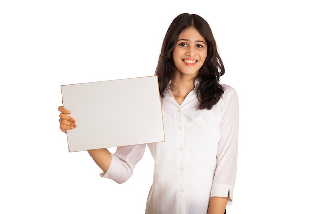 A young girl or businesswoman holding a signboard in her hands on a white background