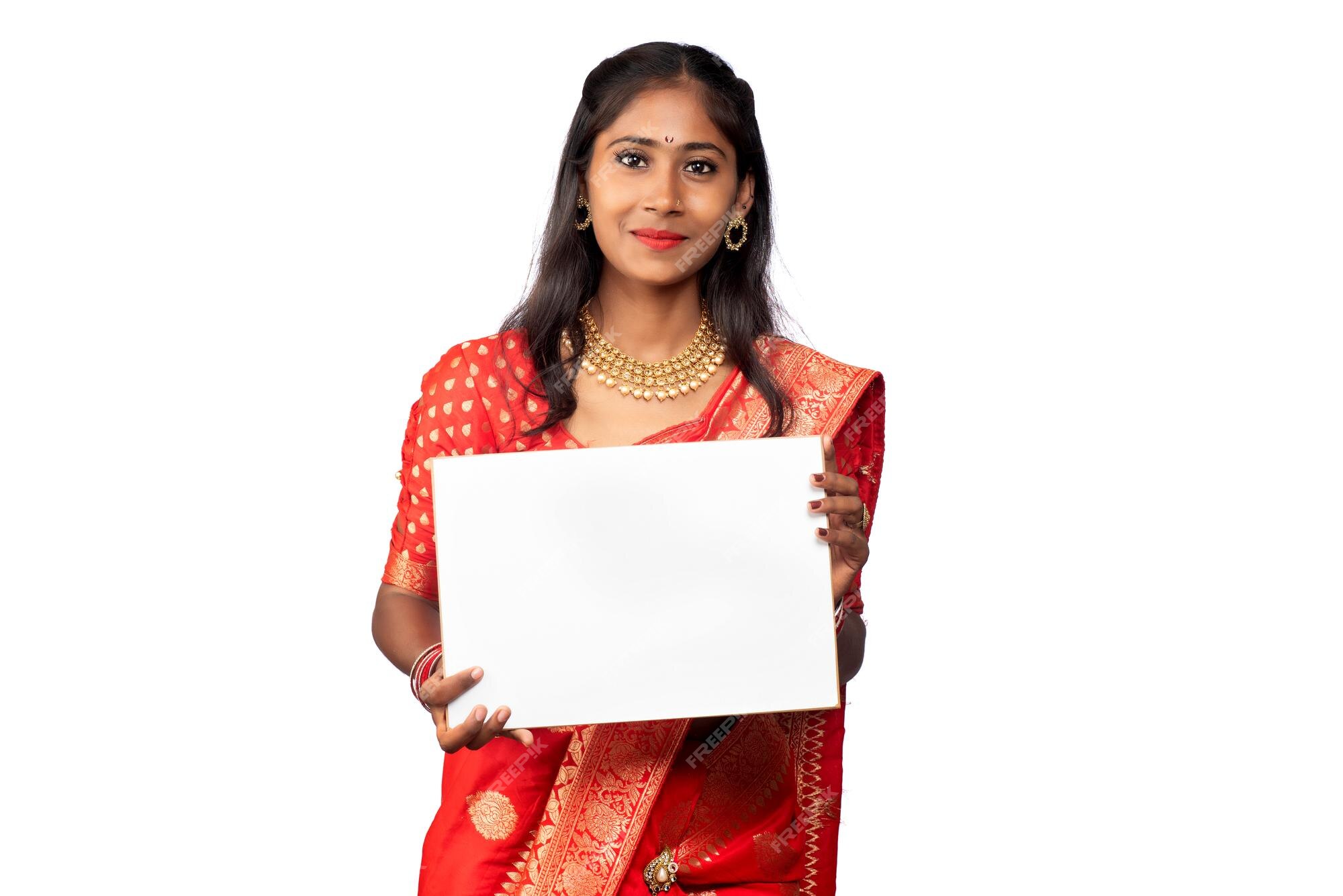 Premium Photo | A young girl or businesswoman wearing a saree and holding a  signboard in her hands on a white background