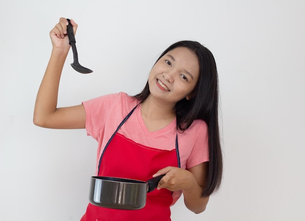 Young girl cook with frying pan on white background