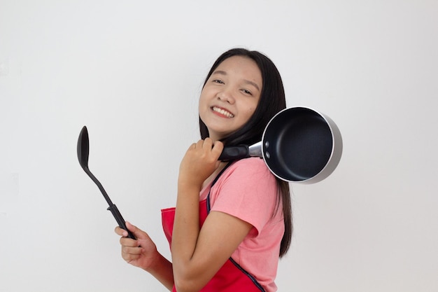 Young girl cook with frying pan on white background