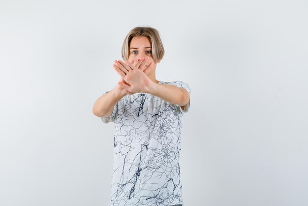 Young girl crossing her hands on white background