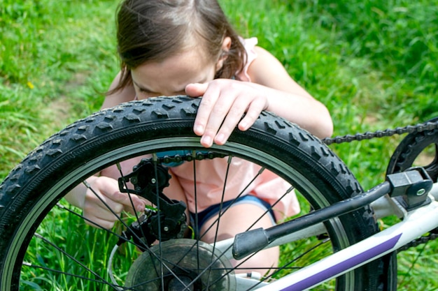 Young girl cyclist enjoy the beautiful sunrise on summer forest trail