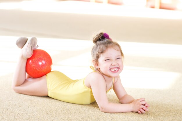 Young girl doing gymnastics.