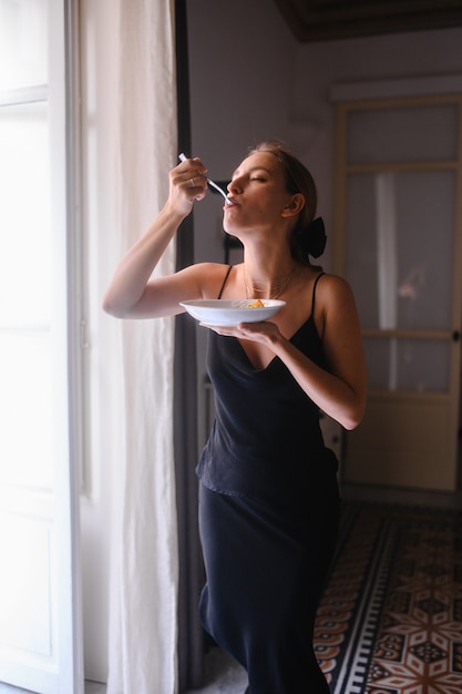 Young girl eats tasty food