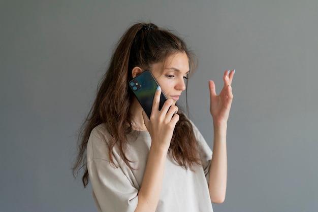 Young girl emotionally talking on the phone