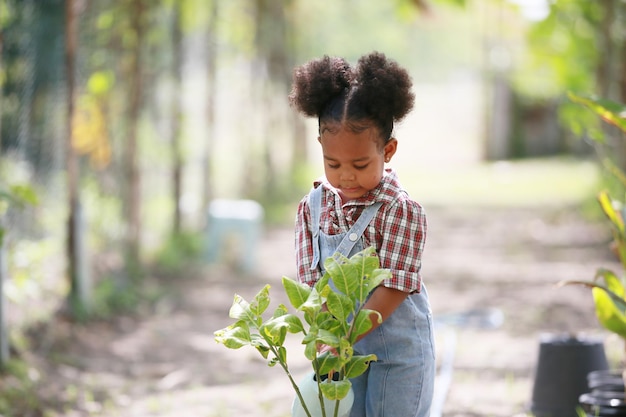 Young girl enjoy activity in plantation at organic farm