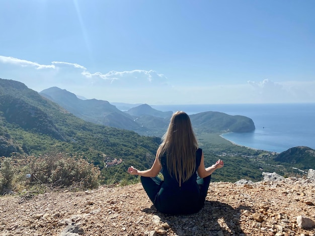 Young girl enjoying the beauty of nature, relaxing, meditating, adventure